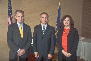 Joining together at the October luncheon are (l-r) Mark Witzel, chapter president; Jeff Mercer, director, Strategic Communications Joint Program Executive Office for the Joint Tactical Radio System; and Vicki Hines, chapter vice president for programs.